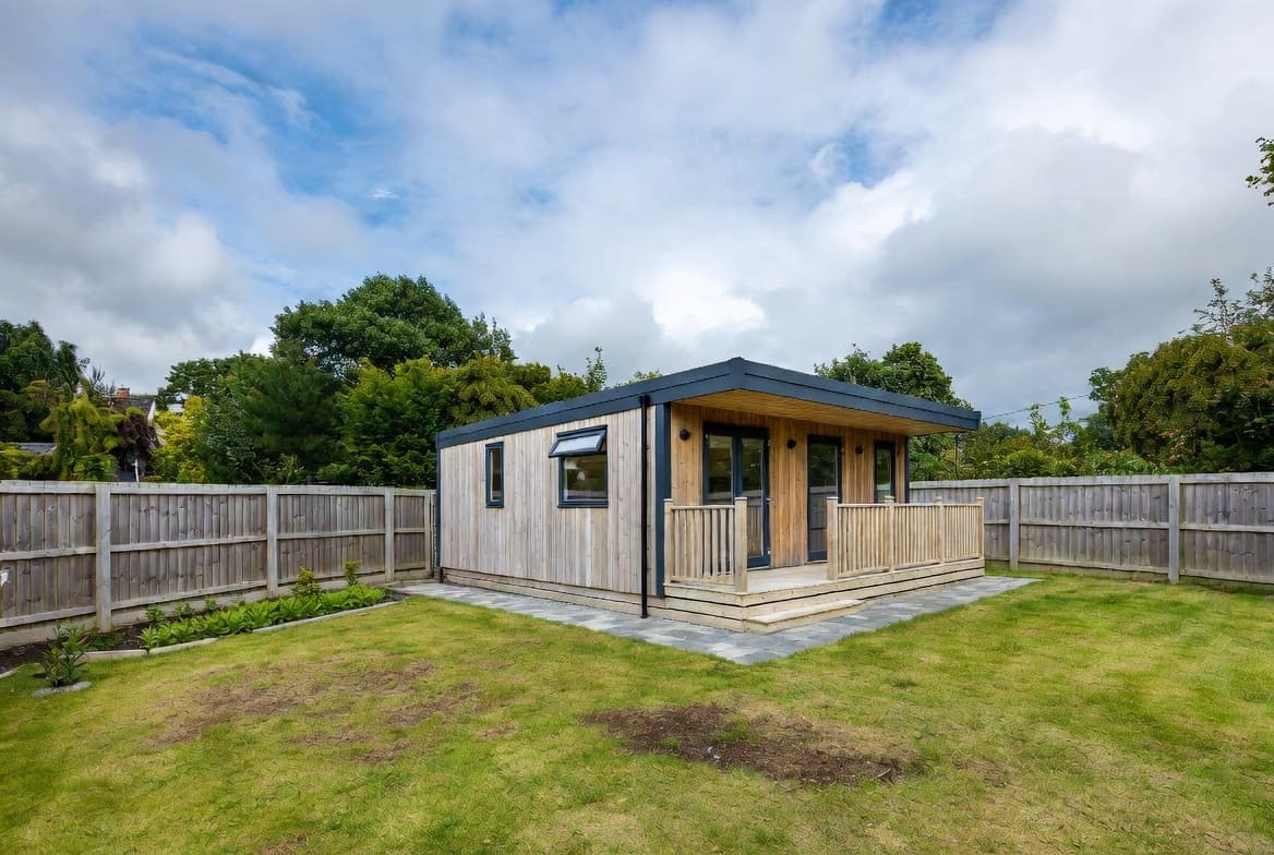 Modern timber-clad modular home with glass doors and deck in East Cork garden