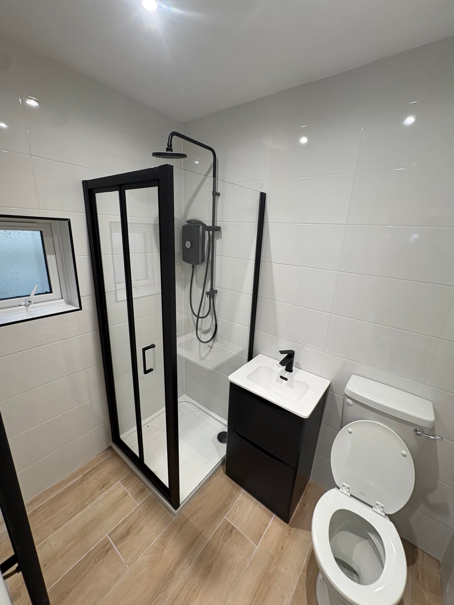 Modern bathroom renovation with premium fixtures by Morley Services in East Cork
